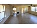 Spacious living room featuring a fireplace, sliding glass doors to the outside, and lots of natural light at 4226 Lake Richmond Dr, Orlando, FL 32811