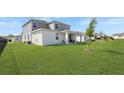Spacious backyard with lush green grass, offering ample space for outdoor activities and relaxation at 4623 Wandsworth Way, Davenport, FL 33837