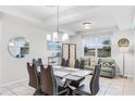 Elegant dining area featuring a modern table setting and an inviting adjacent sitting area at 4721 Clock Tower Dr # 106, Kissimmee, FL 34746