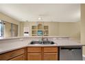 Kitchen features stainless steel appliances, light wood cabinetry, and an eat-in bar at 4900 Marbella Isle Dr, Orlando, FL 32837