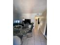 Spacious dining room with glass table at 723 Michigan Ct # 3, St Cloud, FL 34769