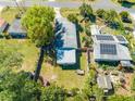 Overhead shot displays backyard and home layout within a fenced property at 1211 Shawnee Dr, Kissimmee, FL 34744