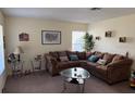 Comfortable living room featuring a large sectional sofa and natural light at 133 Rona Ln, Davenport, FL 33897