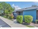 Inviting single-story home with manicured bushes, a brick and siding facade, and sidewalk at 2435 King Oak Ln, St Cloud, FL 34769