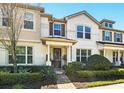 Charming two-story townhome with a well-manicured front yard and inviting entrance at 2920 Windmill Dr, Kissimmee, FL 34741