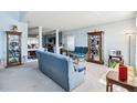 Cozy living room with blue walls, carpet, pillars, and traditional furnishings and decorations at 417 Spice Ct, Kissimmee, FL 34758