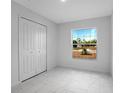Bright, airy bedroom with a closet and a large window with a clear view at 101 Sail Way, Kissimmee, FL 34759