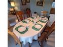 Formal dining area with a set table, perfect for elegant dinners at 12966 Broakfield Cir, Orlando, FL 32837