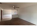 Open living room featuring carpet flooring, neutral paint, and a ceiling fan at 1304 Mill Creek Pl, Kissimmee, FL 34744