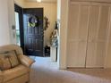 Foyer with tile flooring, coat closet, and neutral tones create a welcoming atmosphere at 2809 Wingfoot Ct, Winter Haven, FL 33884