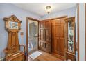 Inviting foyer featuring hardwood floors and a vintage decor at 3970 Kissimmee Park Rd, St Cloud, FL 34772