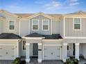 Charming townhome with brick driveway and one car garage at 4672 Tribute Trl, Kissimmee, FL 34746