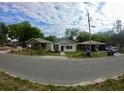 Neighborhood street view showcases the property's location and curb appeal of well-kept residences at 516 W 7Th St, Lakeland, FL 33805