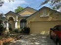 Charming single-Gathering home with a two-car garage and well-manicured landscaping at 10809 Oak Glen Cir, Orlando, FL 32817