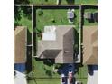 A closer aerial view showing the home, backyard, roof, and surrounding properties at 1155 Roan Ct, Kissimmee, FL 34759
