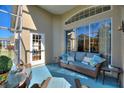 Inviting covered lanai with comfortable seating, perfect for outdoor relaxation at 121 Fitzgerald Ln, Davenport, FL 33837