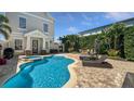 Inviting backyard oasis features a sparkling pool and spa with ample lounge seating at 1506 Euston Dr, Reunion, FL 34747