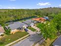 Aerial view of a neighborhood with lush greenery, waterfront access, and well-maintained homes at 1532 Reade Cir, St Cloud, FL 34772