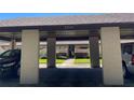 Carport view of the condo's entrance at 2246 Firestone Pl, Winter Haven, FL 33884