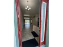 Spacious foyer with tiled floors leading into the open living areas at 2714 University Acres Dr, Orlando, FL 32817