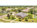 Expansive aerial view of a single-Gathering home showcasing its lush landscaping at 2801 Palmyra Ct, St Cloud, FL 34772