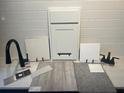 Home design selections featuring tile, carpet, counter samples, white cabinet door, and black faucet against a subway tile backsplash at 2955 Gavin Sky Dr, Kissimmee, FL 34744