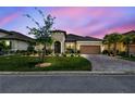 Beautiful single-story home featuring a manicured lawn and a brick-paved driveway with a two-car garage at 3775 Via Mazzini Ct, Kissimmee, FL 34759