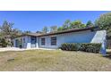 Charming one-story home featuring a blue exterior, with green lawn at 600 Swallow Dr, Casselberry, FL 32707