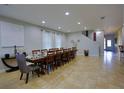 Spacious dining room with seating for twelve, neutral walls and ceramic tile flooring at 7664 Wilmington Loop, Kissimmee, FL 34747