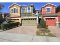 Colorful townhomes featuring brick driveways and well-maintained landscaping at 9535 Silver Buttonwood St, Orlando, FL 32832