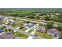 Aerial view featuring a residential street with lovely single-Gathering homes and green spaces at 1167 Saint Tropez Ct, Kissimmee, FL 34759