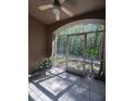 Screened porch offering an outdoor retreat, featuring tiled flooring and serene views of the surrounding greenery at 14341 Fredricksburg Dr # 1016, Orlando, FL 32837