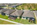 Aerial view showcases the home's backyard, screened lanai, and surrounding neighborhood at 164 Montoro Ln, Davenport, FL 33837