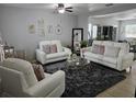 Cozy living room with stylish decor, plush seating, and a modern rug at 2015 Barstow Ln, Dundee, FL 33838
