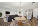 Open-concept living space with modern furnishings adjacent to a spacious kitchen at 2238 Gold Dust Dr, Clermont, FL 34715