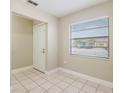 Inviting entryway with neutral paint, ceramic tile flooring, and a window with natural light at 2305 St Marteen Ct # 2305, Kissimmee, FL 34741