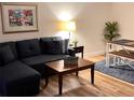 Cozy living room featuring a comfortable couch and modern decor at 3100 Parkway Blvd # 113, Kissimmee, FL 34747