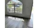 Bright entryway featuring a large window, modern flooring, and plenty of natural light at 322 Ashburton Way, Kissimmee, FL 34758