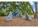 Community playground featuring climbing structures and slides for outdoor recreation and activities at 329 Alexandrite St, Deland, FL 32720