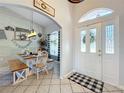 Welcoming foyer with a view of the dining area, featuring shiplap walls and farmhouse decor at 4907 Raylene Way, St Cloud, FL 34771