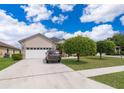 Charming single-story home with well-manicured lawn and a two-car garage at 4910 Culdesac Ct St, St Cloud, FL 34772