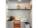 Efficient office space with floating shelves, compact desk, and natural light at 5316 Burning Tree Dr # A09-2, Orlando, FL 32811