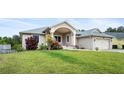 A inviting single-story home with manicured lawn and attractive landscaping enhancing curb appeal at 5524 Loma Vista, Davenport, FL 33896