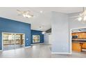 Bright living room with vaulted ceilings, tile floors, and access to the backyard at 5524 Loma Vista, Davenport, FL 33896