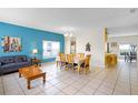 Open living and dining area with tile flooring and neutral wall paint at 814 Bloomingdale Dr, Davenport, FL 33897