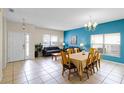 Inviting living room features tile floors, a dining area, and natural light at 814 Bloomingdale Dr, Davenport, FL 33897