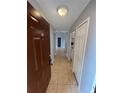 Inviting entryway features neutral walls, ceramic tile floor, and a view through to the rest of the property at 5226 Via Hacienda Cir # A314, Orlando, FL 32839