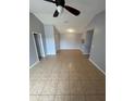 Living Room features ceramic tile flooring, neutral paint, ceiling fan, and an open layout at 5226 Via Hacienda Cir # A314, Orlando, FL 32839