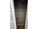 Pantry with multiple wire shelves for ample food and storage, ceramic tile floor, and a light gray wall at 5226 Via Hacienda Cir # A314, Orlando, FL 32839