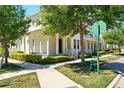 Beautiful townhouse with lovely landscaping and mature trees surrounding the property at 1370 Kiawah St, Celebration, FL 34747